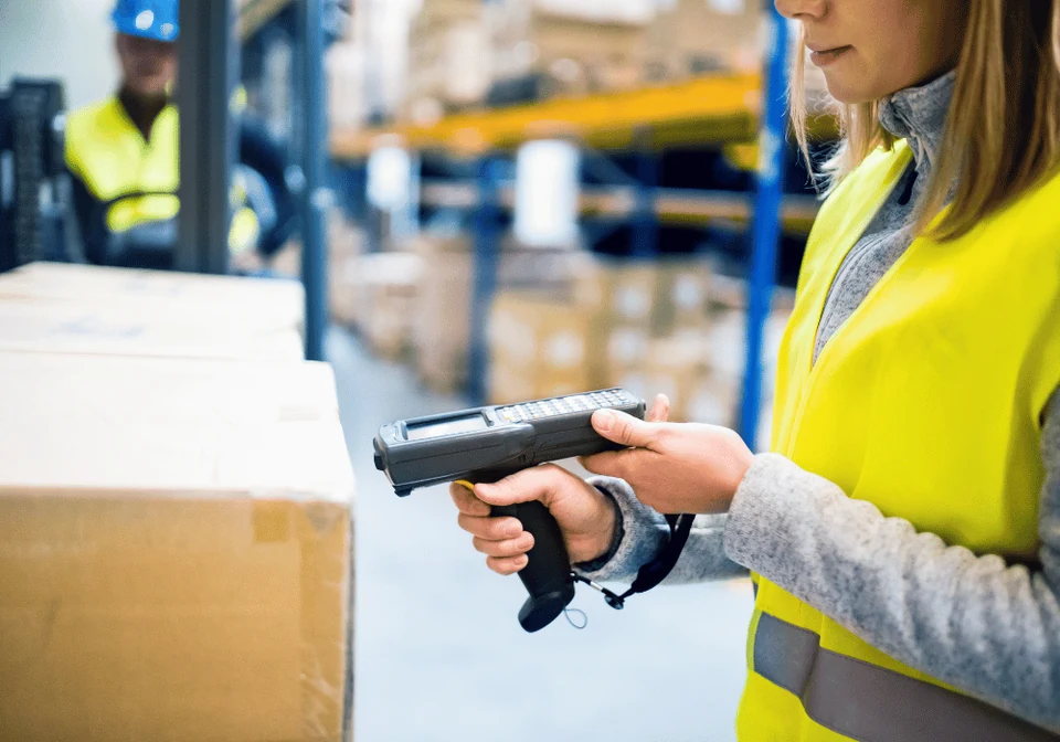 Warehouse colleague using a professional barcode scanner